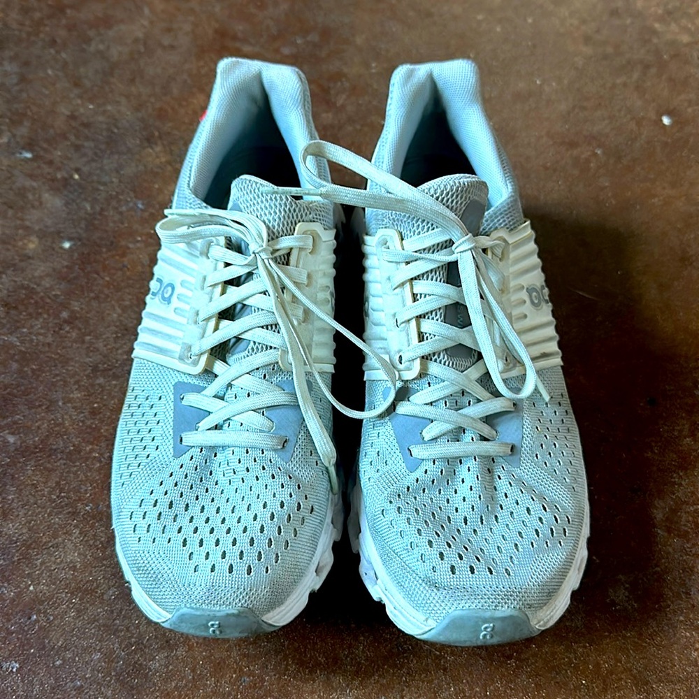 Woman on cloud sneakers. Size 7.5. White and Grey.